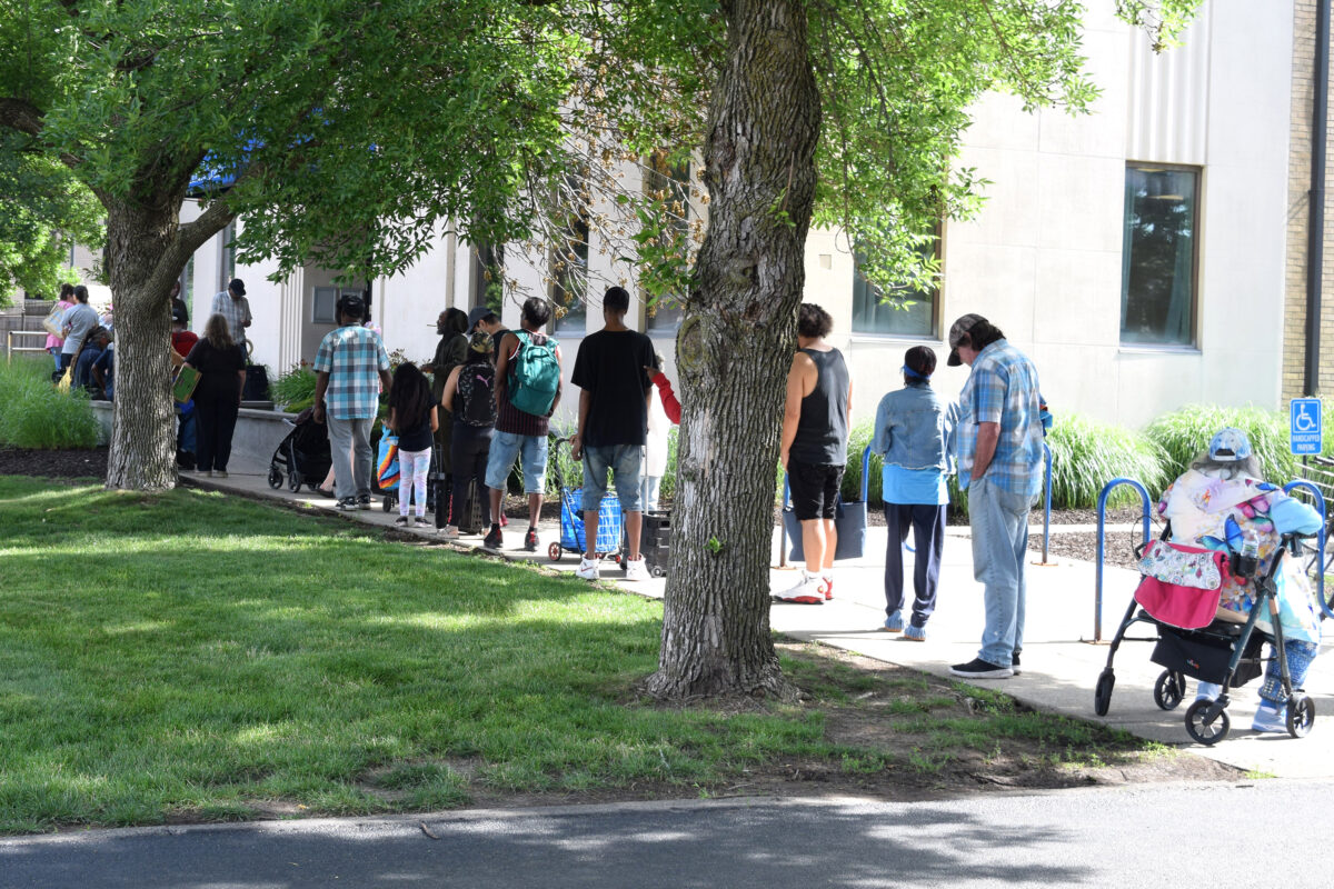 People waiting in line at the food pantry