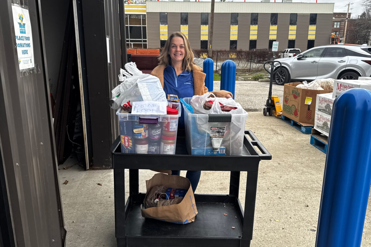A smiling volunteer during a food drive